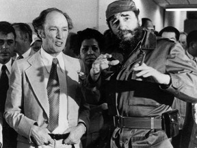 Prime Minister Pierre Trudeau looks on as Cuban President Fidel Castro gestures during a visit in Havana on Jan. 27, 1976. Canada's spy service destroyed a Cold War dossier on Pierre Trudeau in 1989 instead of turning it over to the national archives,