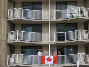 A flag is attached to the balcony of Edmonton House on Wednesday, June 26, 2019 in Edmonton. (Greg Southam-Postmedia)