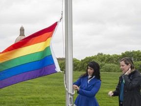 The pride flag was raised at the Alberta Legislature grounds on June 7, 2019, by Minister of Culture, Multiculturalism and Status of Women Leela Sharon Aheer and city councillor Sarah Hamilton. Photo by Shaughn Butts / Postmedia