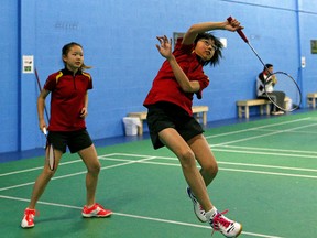 Jessie Hou, left, 14, and Alena Yu, 13, are competitive badminton players.