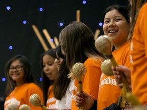 Students sing during a Reconciliation in Education Week ceremony at the Sacred Heart Centre, 9624 108 Ave., in Edmonton Friday June 7, 2019. The ceremony culminated in a reconciliation walk to Victoria School. Photo by David Bloom