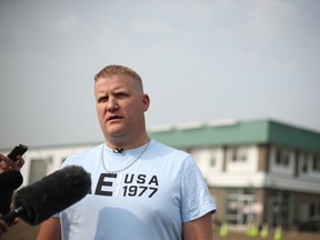 Slave Lake Mayor Tyler Warman gives an update on the wildfires raging near the town outside the Slave Lake fire hall on June 1, 2019.