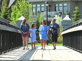 Brianna Tilley, 17, along with sister Addison, 10, walk with mom Shannon  and dad Brad near their home in the Griesbach neighbourhood.