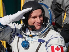 David Saint-Jacques of the Canadian Space Agency, a member of the International Space Station boards the Soyuz MS-11 spacecraft shortly before the launch in Kazakhstan on December 3, 2018.