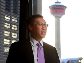 Duncan Au, president and CEO of CWC Well Services Corp, poses in his downtown Calgary office in Calgary on December 6, 2013. Photo by Christina Ryan, Postmedia