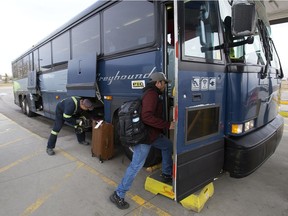 Customers board the last outgoing Greyhound bus at the Edmonton Greyhound station, Wednesday Oct. 31, 2018. Greyhound Canada ended all routes in Alberta on Oct. 31, 2018.