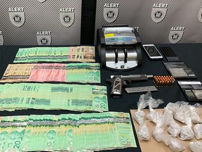 Police in Fort McMurray have arrested one man after officers seized drugs, cash and a handgun with a filed off serial number last week. (Photo supplied/ALERT)