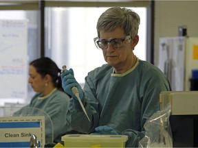 A lab worker at the University of Alberta Hospital on Thursday December 21, 2017. File photo.