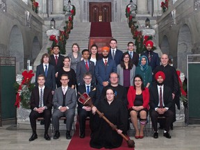 Members of the 99th Session of the TUXIS Parliament of Alberta pose on the steps inside the legislature. The organization is celebrating 100 years in 2019.