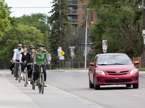 Krista Zerbin leads a group of cyclists down 83 Avenue near 106 Street on a bike ride hosted by the City of Edmonton's Bike Street Team on Wednesday, June 5, 2019, in Edmonton.  Saturdays from June 1 - September 28, the City of Edmonton Bike Street Team will offer free guided bike ride alongs of Edmonton's southside and downtown protected bike routes. The ride alongs will depart the Old Strathcona Farmers' Market at 10 a.m. This is one of the city's Vision Zero initiatives to help people drive, bike and walk around Edmonton safely. Register at edmonton.ca/visionzero to secure a spot.