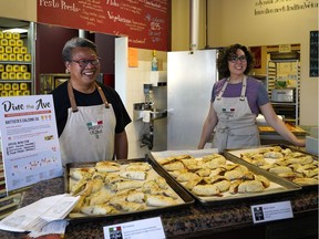 Employees Doug Mah (left) and Rosa Pomares (right) at Battista's Calzone Co. File photo.