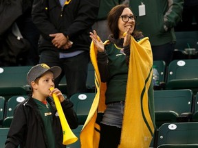 Fans cheer as the Edmonton Eskimos beat the B.C. Lions during a CFL football game at Commonwealth Stadium in Edmonton, on June 21, 2019.