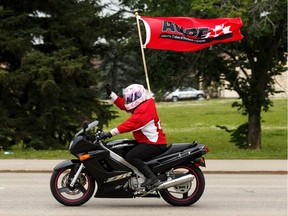 A motorcyclist flies the Alberta Union of Provincial Employees (AUPE) flag as members held an information picket outside of Leduc Community Hospital to rally against the UCP government's Bill 9 in Leduc, on Tuesday, July 9, 2019.