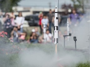 A small scale Saturn V rocket lifts off Tuesday, July 16, 2019, to celebrate the 50th anniversary of NASA's Apollo 11 mission to land on the Moon at Telus World of Science.