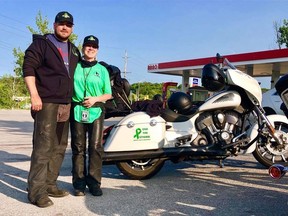David and Rochelle Hynes pose next to their motorcycle in this supplied image.