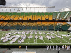 Revellers on the field during Le Diner en Blanc at Commonwealth Stadium on Wednesday, July 17.