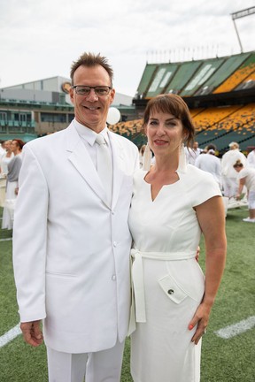 Todd Weiss, left, with Tracy Metz during Le Diner en Blanc at Commonwealth Stadium.