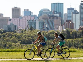 Cyclists ride through Forest Heights Park as the temperature soars past 30 degrees Celcius in Edmonton, on Monday, July 22, 2019.