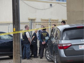 Edmonton police raided a row of businesses along 111 Avenue near 93 Street on Wednesday, July 24, 2019. Agents from the Canada Revenue Agency could be seen handling computers and hard drives.