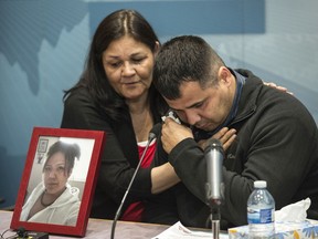 Vivian Tuccaro and her son Paul Tuccaro comfort each other before taking media questions after Deputy Commissioner Curtis Zablocki's apology on behalf of the RCMP for their investigation into Amber Tuccaro's case.