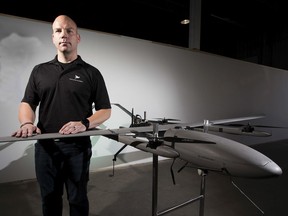 Cole Rosentreter, Chief Executive Officer, Pegasus Imagery with one of the companies drones on Tuesday, July 30, 2019 in Edmonton.  The Edmonton company builds massive commercial drones for farmers, fighting forest fires and the military.
