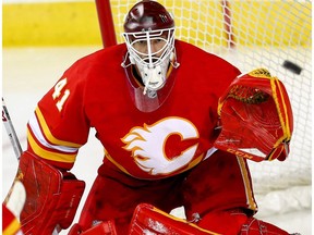 Calgary Flames goalie Mike Smith makes a save on a shot by Colorado Avalanche in game two of the Western Conference First Round during the 2019 NHL Stanley Cup Playoffs at the Scotiabank Saddledome in Calgary on Saturday, April 13, 2019.