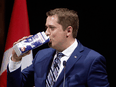 Kidding, not kidding: Conservative Leader Andrew Scheer pokes fun at his alleged links to the dairy industry at the National Press Gallery Dinner in 2017.