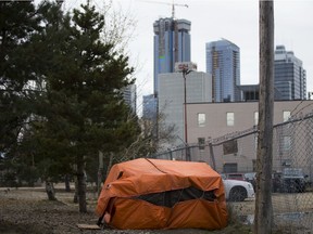 A makeshift shelter set up along the bike path that runs beside the LRT tracks between 96 Street and 95 Street and 105 Avenue and 106 Avenue, in Edmonton Monday Oct. 15, 2018. File photo.