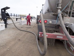 The Global Energy Monitor says an international boom in liquefied natural gas exports is undermining global efforts to stop climate change and Canada is one of the industry's biggest players. A worker fills his truck at the Shell Sunset water hub for the Groundbirch Saturn natural gas plant outside of Fort St. John, B.C., Thursday, Oct. 11, 2018.