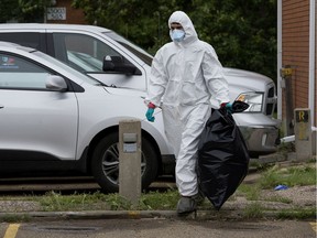 Crews work to clean up flooded homes in Edmonton's Griesbach neighbourhood on Thursday, July 25, 2019.