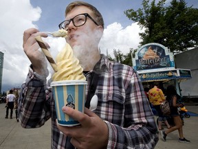 Reporter Jason Herring tries the award winning Butterbeer soft serve ice cream at K-Days, in Edmonton Friday, July 19, 2019.
