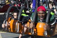 The Edmonton Eskimos' Vontae Diggs enjoys the rides during Monday Morning Magic at K-Days in Edmonton on Monday, July 22, 2019. 500 children with special needs between the ages of three and 12 had the fairgrounds to themselves during the 42nd annual event.