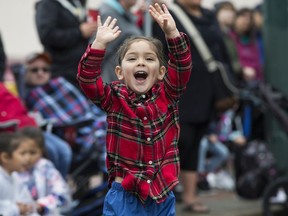 An excited Sydney Stringfellow, 3, watches the K-Days parade make its way through downtown Edmonton, Friday July 19, 2019. Photo by David Bloom