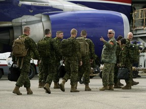 Soldiers from 1 Canadian Mechanized Brigade Group in Edmonton prepare to depart from the Edmonton International Airport on Thursday, July 11, 2019 to join the enhanced Forward Presence Battle Group currently operating in Latvia as part of Operation Reassurance.