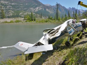 The wreckage of a Cessna 150J that crashed into the Athabasca River east of Jasper on July 21, 2019, is recovered by the Transportation Safety Board of Canada. The crash left one dead and one seriously injured.