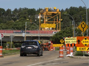 Traffic heads west along River Valley Road towards the Groat Road Bridge, in Edmonton on Friday, July 26, 2019. Starting at 6 a.m. on Saturday, July 27, River Valley Road will be closed under Groat Road to allow for installation of bridge falsework and deck overhang brackets. The shared use path under Groat Road will remain open. The closure is expected to last until Aug. 2.