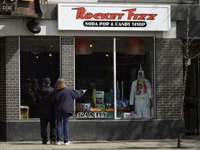 Shama Rangwala, a faculty lecturer of women's and gender studies, entered Rocket Fizz briefly on Sunday afternoon when she noticed a vintage sign advertising "Picaninny Freeze" hanging in the shop. A "picaninny" is a racist caricature. (Photo by Larry Wong/Postmedia)