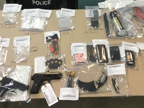Grande Prairie RCMP have arrested four individuals after a hotel search Monday, July 29, 2019 turned up drugs and guns. Image supplied by RCMP.