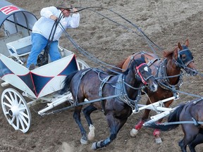 Troy Dorchester driving for CARSTAR Canada, races his wagon in heat two of the GMC Rangeland Derby at the Calgary Stampede in this 2017 file photo.