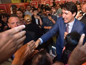 Prime Minister Justin Trudeau greets volunteers and supporters after delivering remarks in the riding of Natural Resources Minister Amarjeet Sohi in Edmonton Mill Woods on Thursday, July 11, 2019.