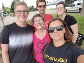 Lorraine Yaremchuk, centre, poses for a selfie to get a bonus clue with fellow SWAT Team members Curtis Yaremchuk, left, Dan Schmidt and Ashley Behrens, and a GoldHunt employee, bottom right. The SWAT Team is competing in the Edmonton GoldHunt for the second time this year. The prize is a whopping $100,000 worth of silver and gold.