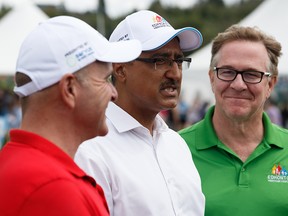 (Left to right) Edmonton-Centre MP Randy Boissonnault, Edmonton Mill Woods MP and Minister of Natural Resources Amarjeet Sohi and Heritage Festival Executive Director Jim Gibbon are seen at the announcement of more than $64,000 in funding for Heritage Festival at Hawrelak Park in Edmonton, on Saturday, Aug. 3, 2019. Photo by Ian Kucerak/Postmedia