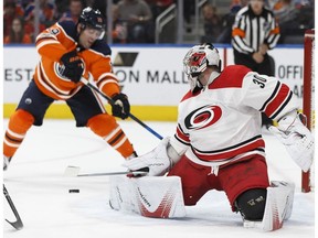 Edmonton's Patrick Maroon (19) is stopped by Carolina's goaltender Cam Ward (30) during the second period of a NHL game between the Edmonton Oilers and the Carolina Hurricanes at Rogers Place in Edmonton, Alberta on Tuesday, October 17, 2017.