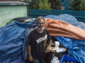 In the driveway behind the home of Candas Jane Dorsey where the city previously threatened to remove the belongings of Daryl Hendricks, a homeless man that Candas has allowed to camp on her property.  Photo by Shaughn Butts / Postmedia