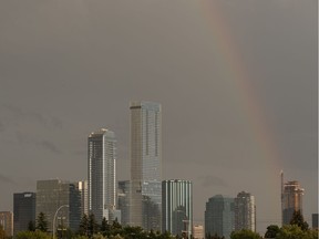 A rainbow is seen over downtown as a thunderstorm rolls through the city in Edmonton, on Friday, Aug. 2, 2019.