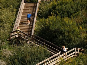 Runners take the stairs near the Fort Edmonton Footbridge on a warm day in west Edmonton, on Sunday, Aug. 4, 2019.