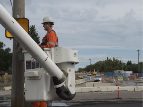 Workers are seen at the Bonnie Doon traffic circle on Tuesday, Aug. 6, 2019. The traffic circle will be reworked to become a standard intersection for the Valley Line LRT.