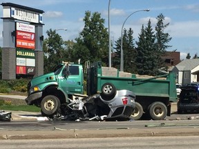 A crash between an SUV and a dump truck closed the Groat Road and 111 Ave intersection in Edmonton on August 7, 2019. Photo supplied by Francis Holubowich