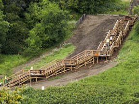 A new stair case is built in the river valley near the Capilano foot bridge on Tuesday, Aug. 13, 2019, in Edmonton.