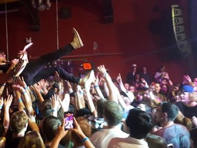 Black Pistol Fire guitarist Kevin McKeown surfs the crowd during the band's performance at Starlite Room on Tuesday, Aug. 13.